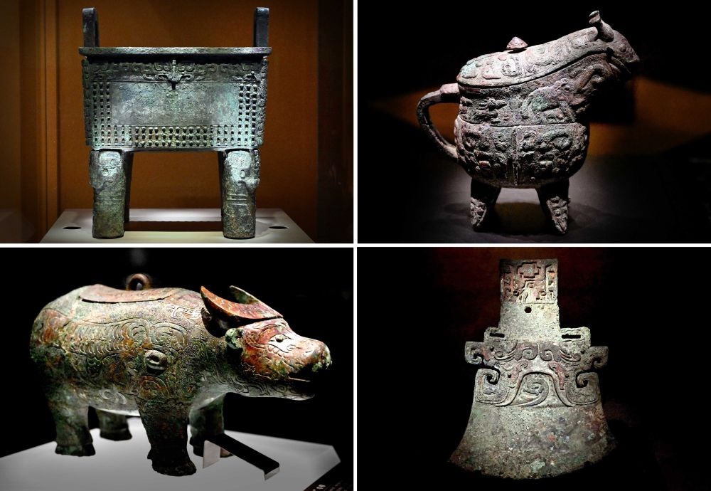 這是殷墟博物館新館內(nèi)展出的“司母辛”銅鼎（左上）、“亞長”銅?。ㄓ疑希?、“亞長”牛尊（左下）、“亞長”銅鉞（拼版照片，2月23日攝）。